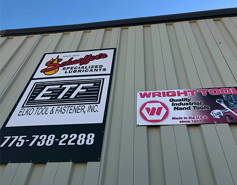 Company Signs On Exterior of Building